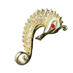 1960s Aurora Borealis and Ruby Red Rhinestone White Enamel and Gold Tone Metal